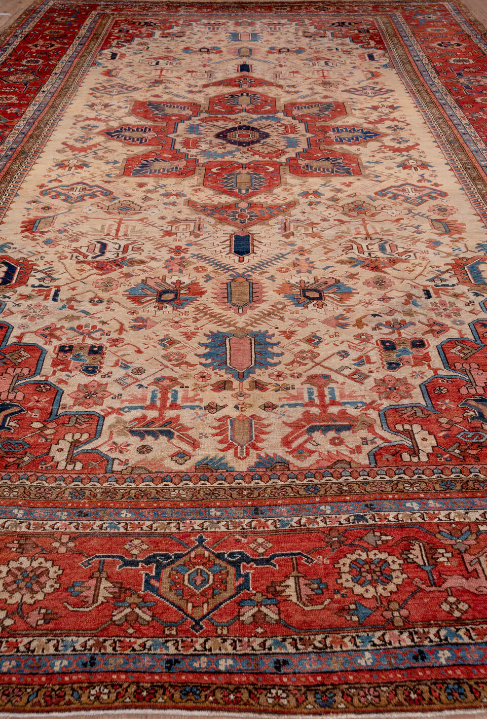 12' x 18' one-of-a-kind handmade vintage Serapi oversize rug. Color palette: arapawa, blue, brown, gray, orange, pink, red