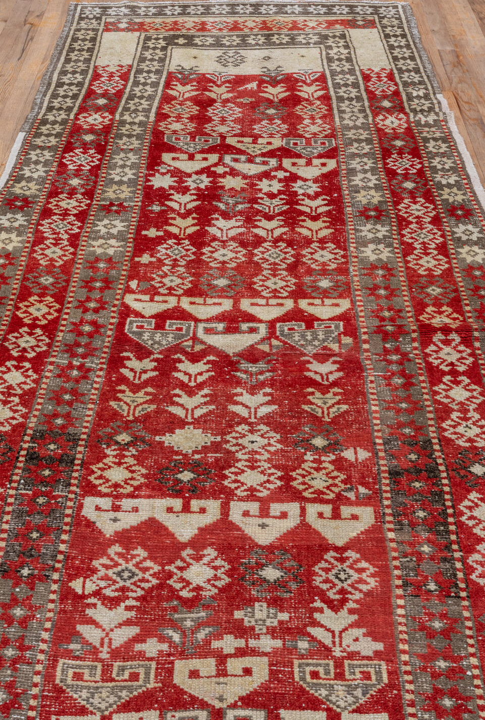 4' x 13' one-of-a-kind handmade vintage Caucasian runner rug. Color palette: brown, gray, pink, red