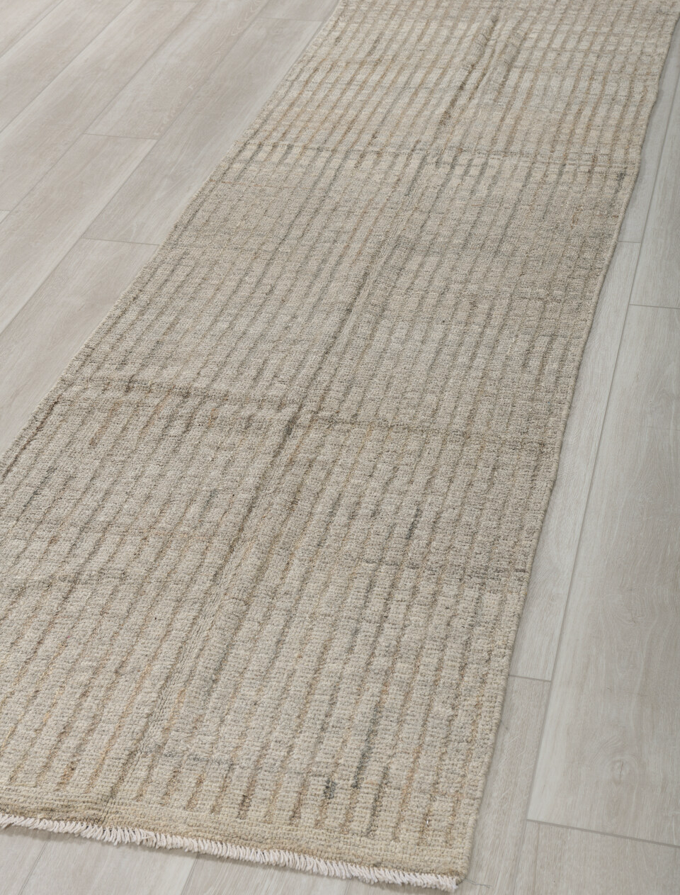 2' x 9' one-of-a-kind handmade vintage Tulu runner rug. Color palette: gray, light gray, off-white, silver