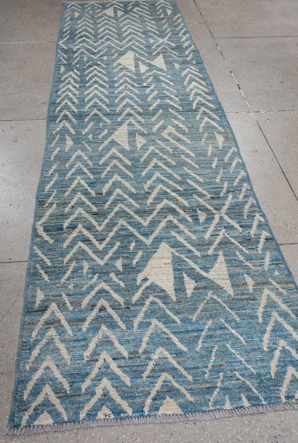 3' x 8' one-of-a-kind handmade vintage Tulu runner rug. Color palette: gray, light gray, light blue, off-white, blue, black