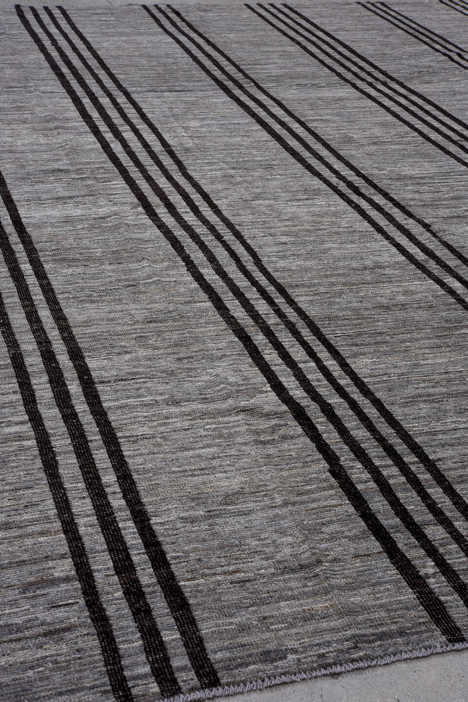 12' x 14' one-of-a-kind handmade vintage Tulu oversize rug. Color palette: black, brown, gray, pink, red