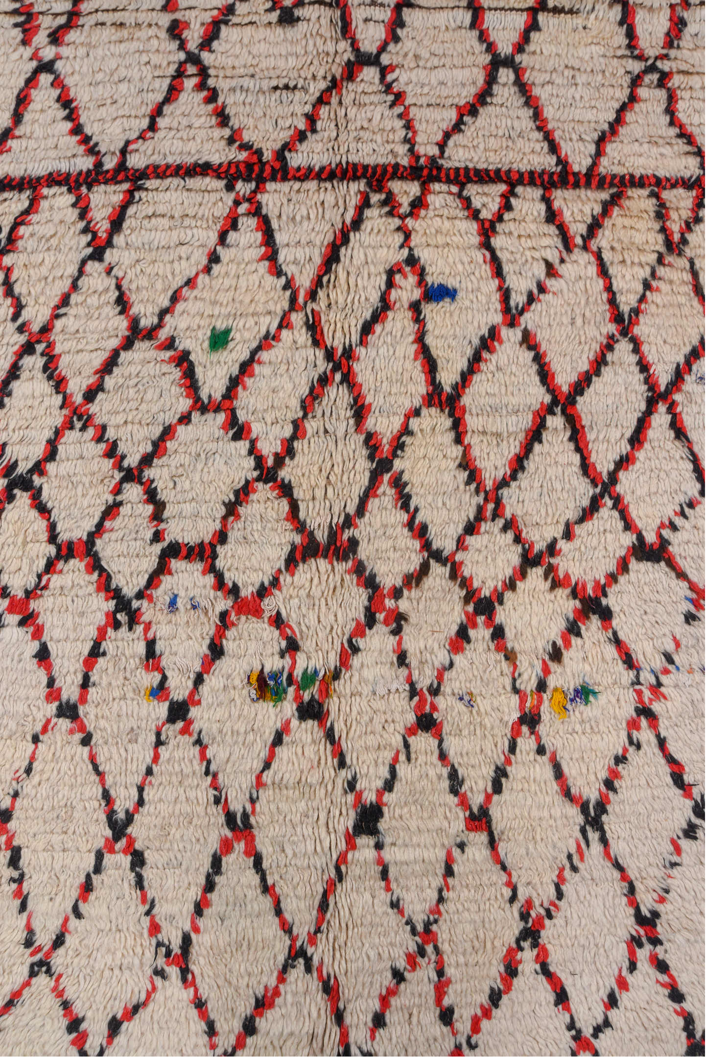 5' x 11' one-of-a-kind handmade vintage Moroccan rug. Color palette: brown, gray, light gray, off-white, pink, red, redwood