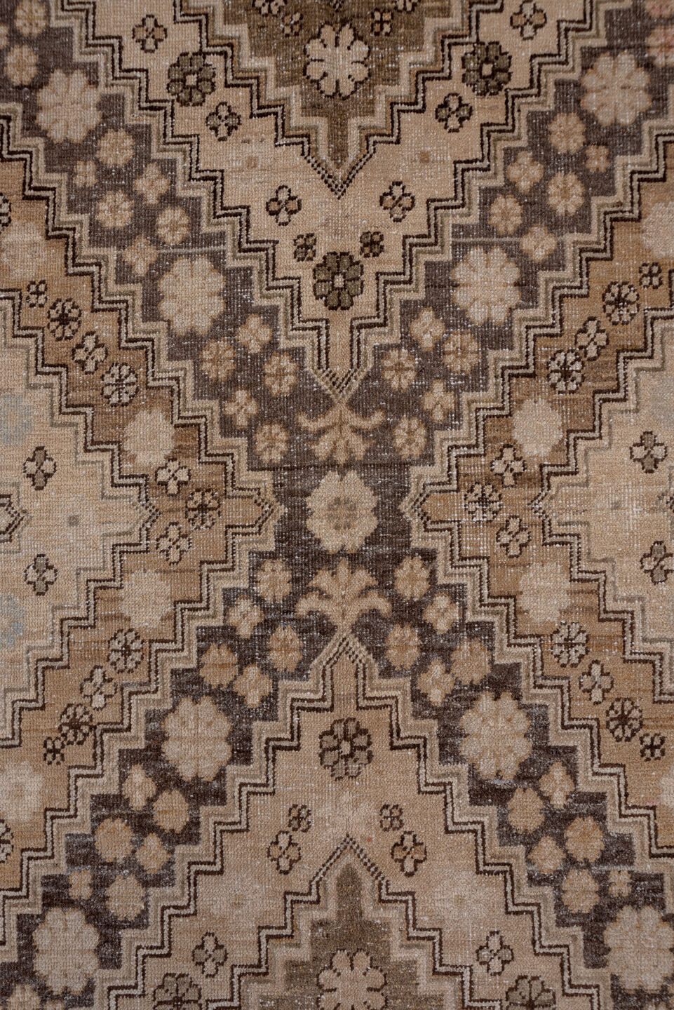 5' x 11' one-of-a-kind handmade vintage Khotan rug. Color palette: brown, gray, light gray, off-white, pink