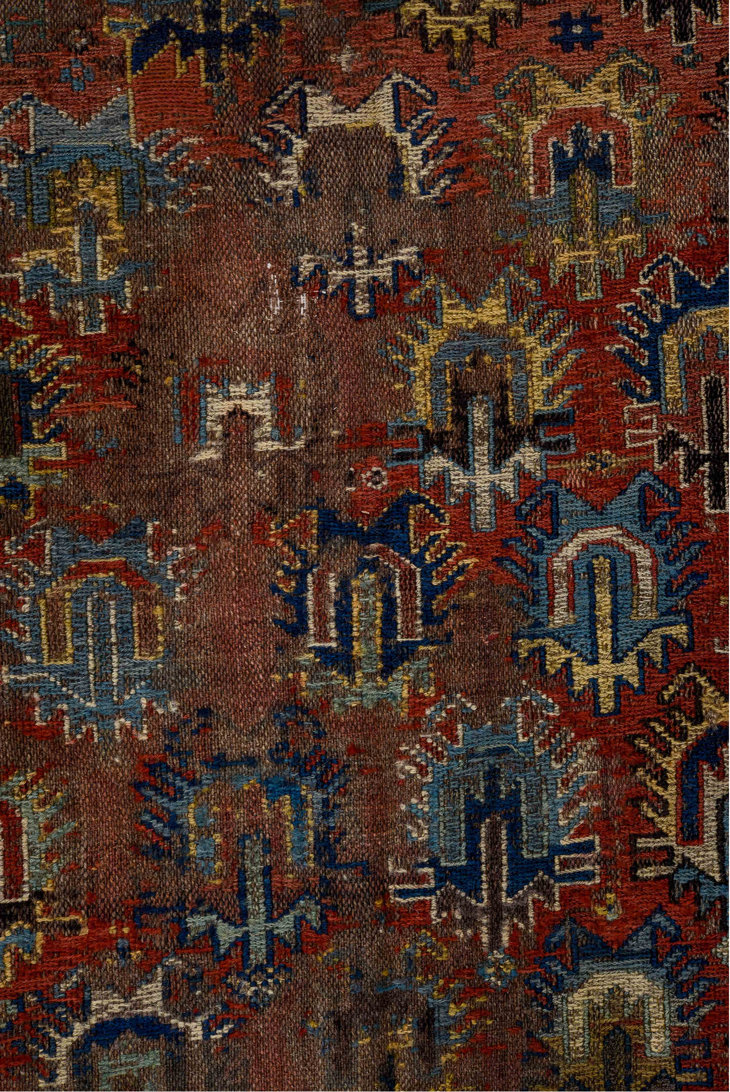 3' x 7' one-of-a-kind handmade vintage Sumak rug. Color palette: brown, yellow, blue, gray, off-white, red, orange, arapawa