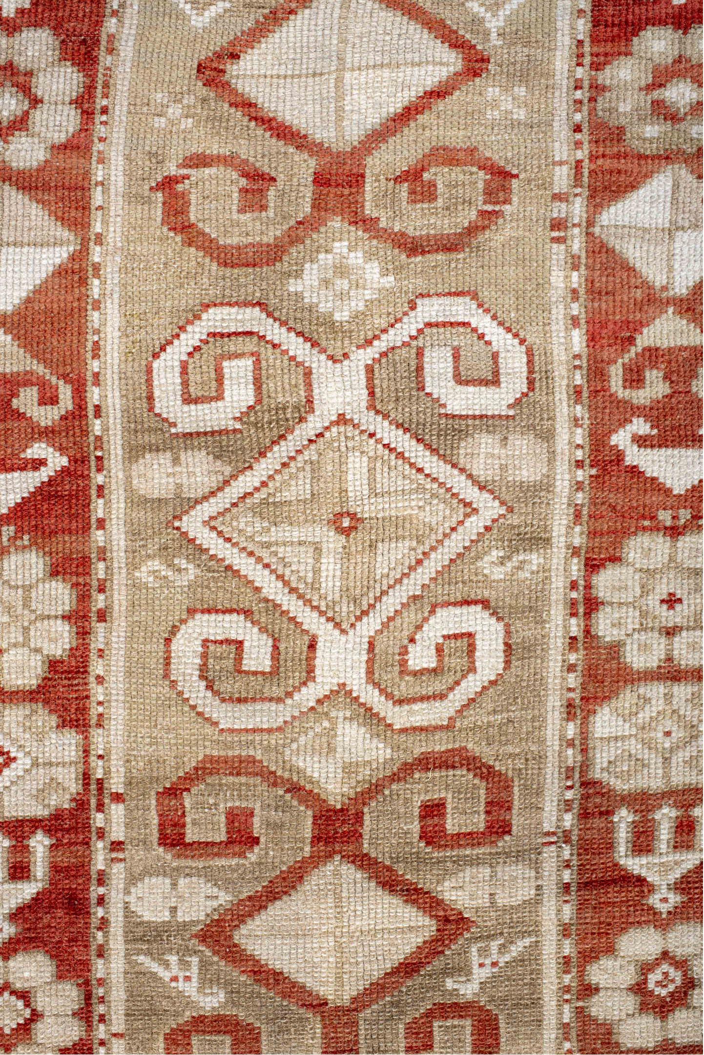 4' x 9' one-of-a-kind handmade vintage Caucasian runner rug. Color palette: brown, gray, light gray, off-white, orange, pink