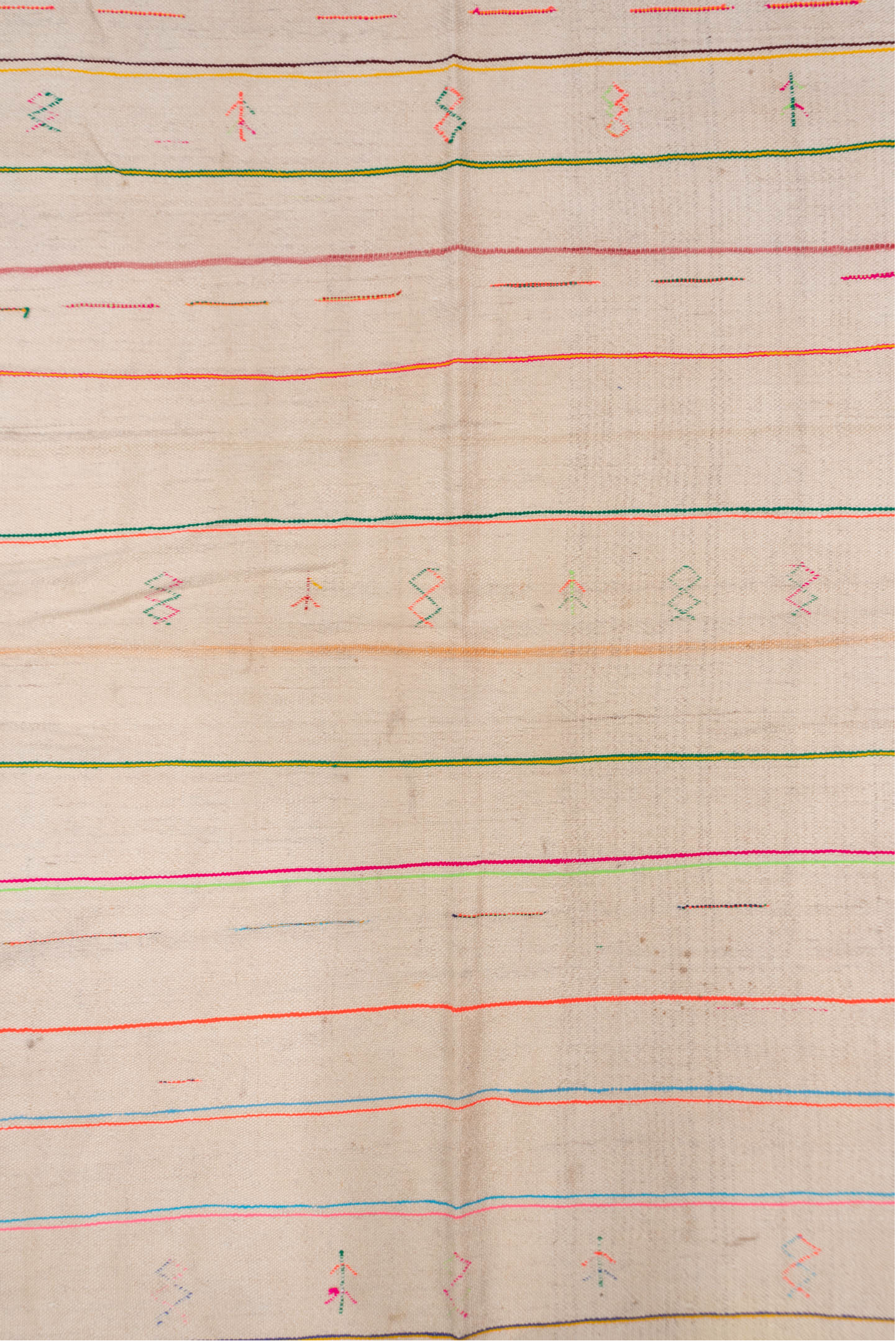 4' x 10' one-of-a-kind handmade vintage Textile runner rug. Color palette: brown, dark gray, gray, light gray, off-white