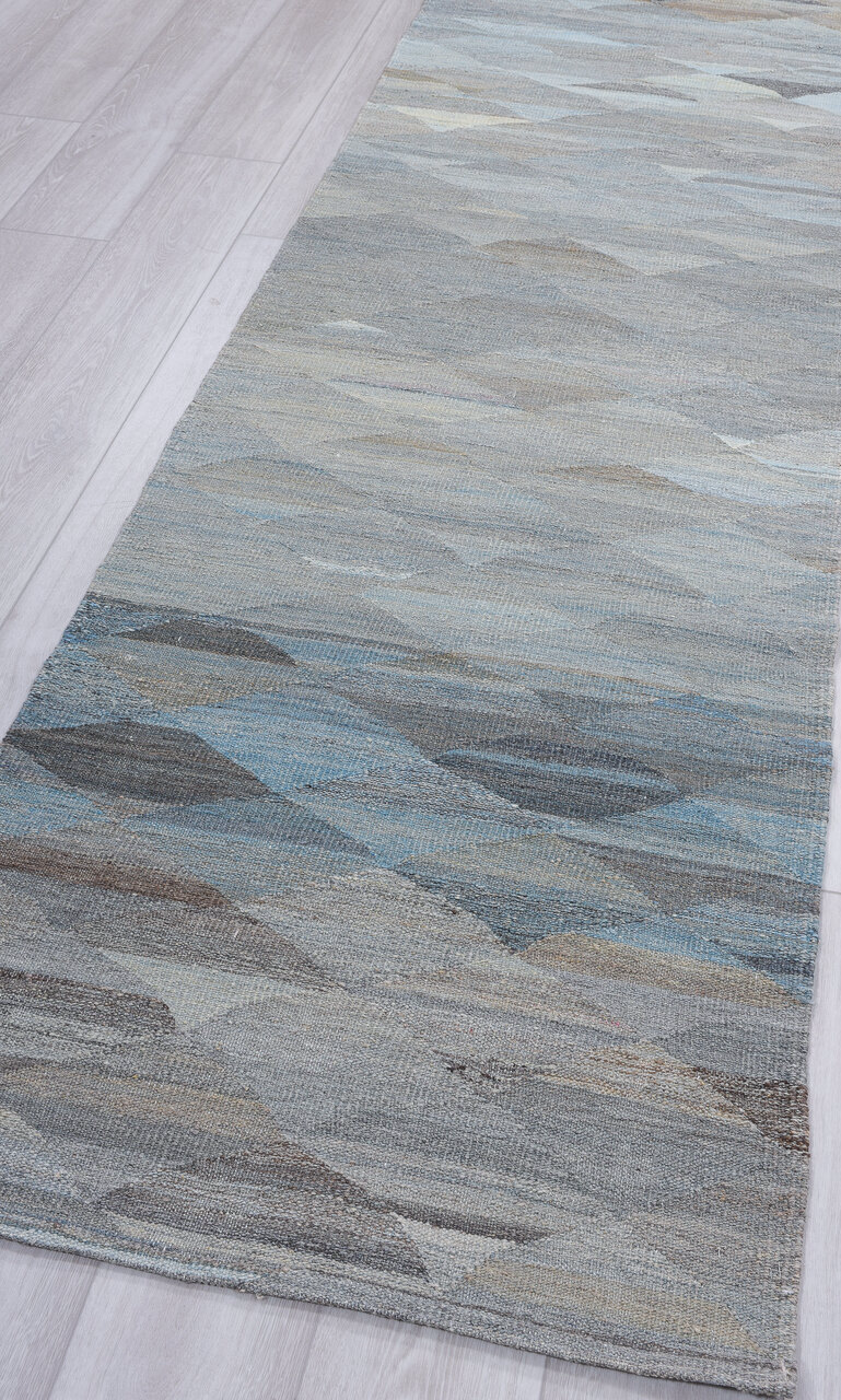 2' x 10' one-of-a-kind handmade vintage Tulu runner rug. Color palette: gray, light blue, light gray, off-white, blue