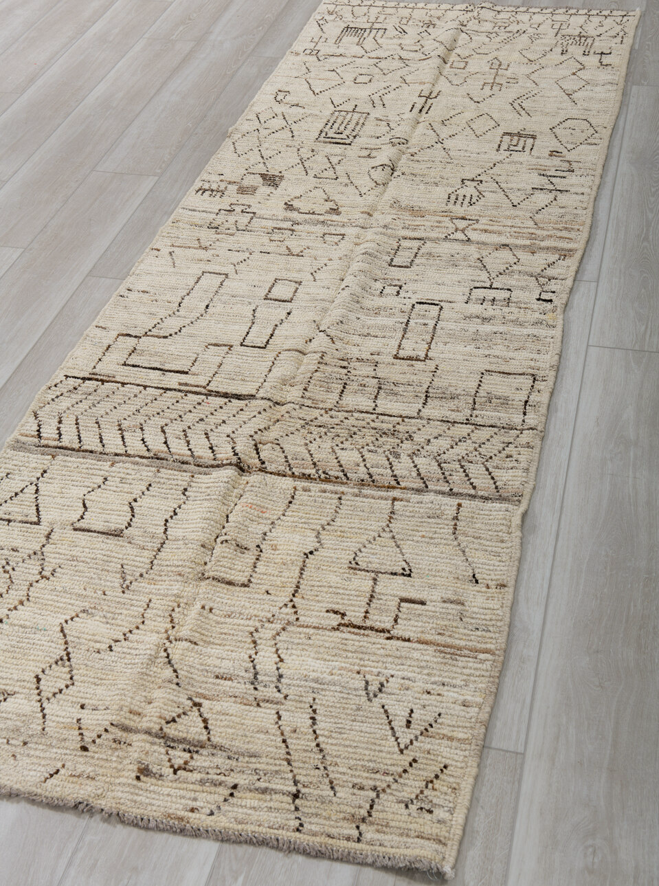 3' x 9' one-of-a-kind handmade vintage Tulu runner rug. Color palette: brown, dark gray, gray, light gray, off-white, silver