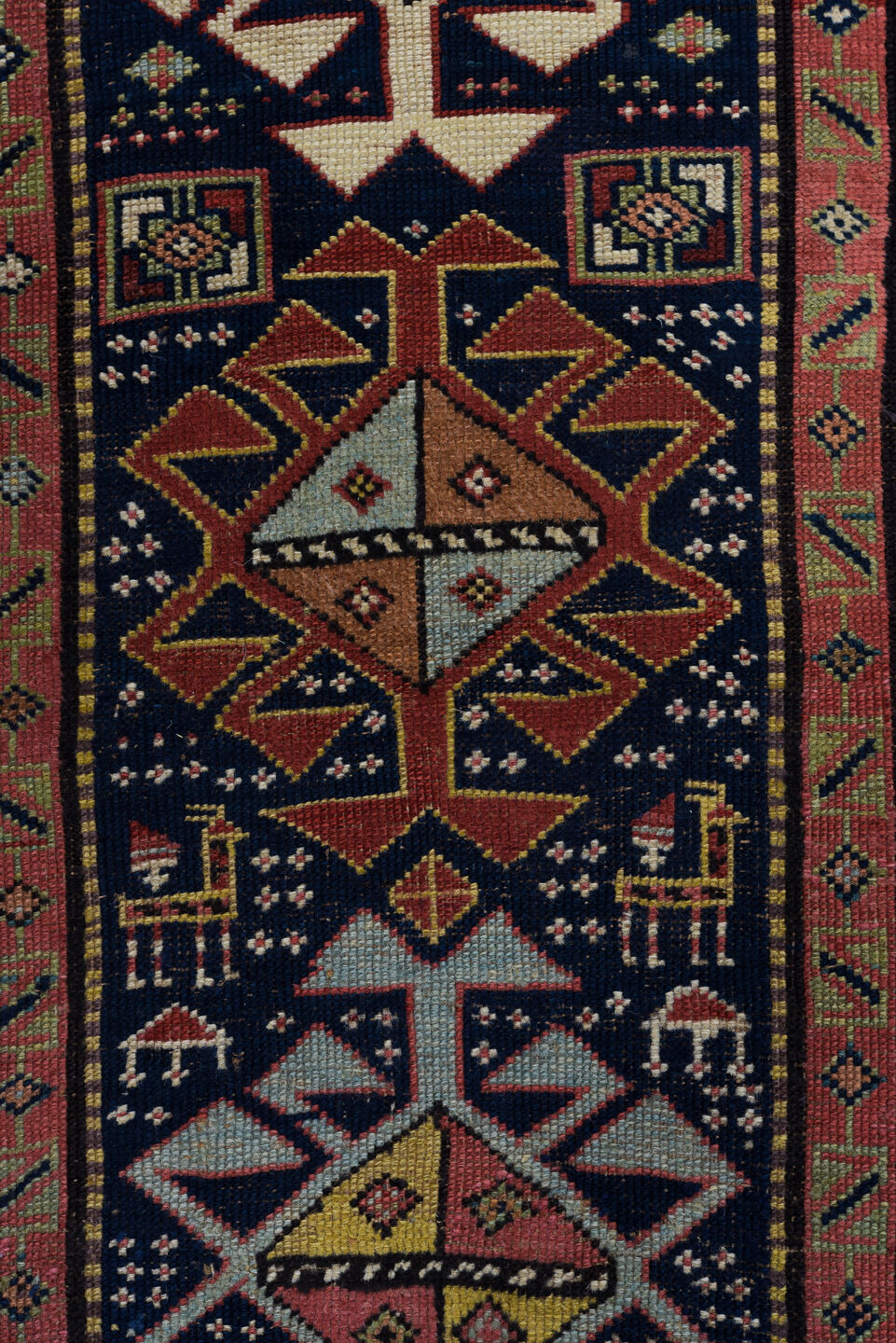 3' x 11' one-of-a-kind handmade vintage Caucasian runner rug. Color palette: black, blue, brown, charcoal, gray, indian red