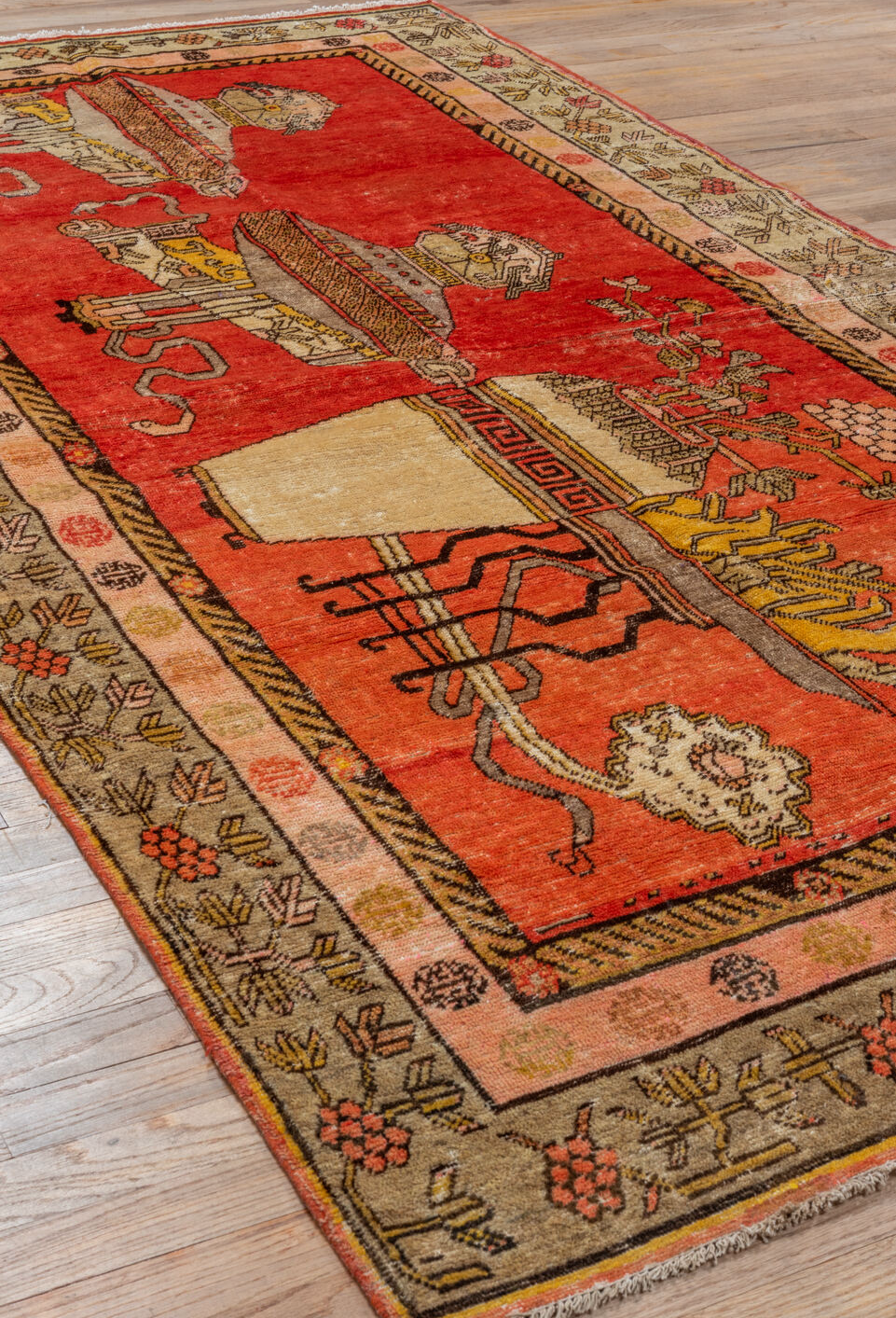 4' x 8' one-of-a-kind handmade vintage Khotan rug. Color palette: brown, dark salmon, orange, pink, red, yellow