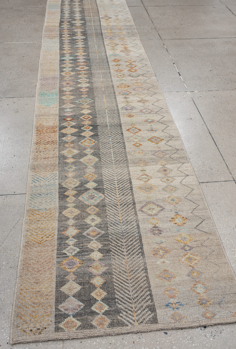 3' x 12' one-of-a-kind handmade vintage Tulu runner rug. Color palette: brown, dim gray, gray, light gray, off-white, orange
