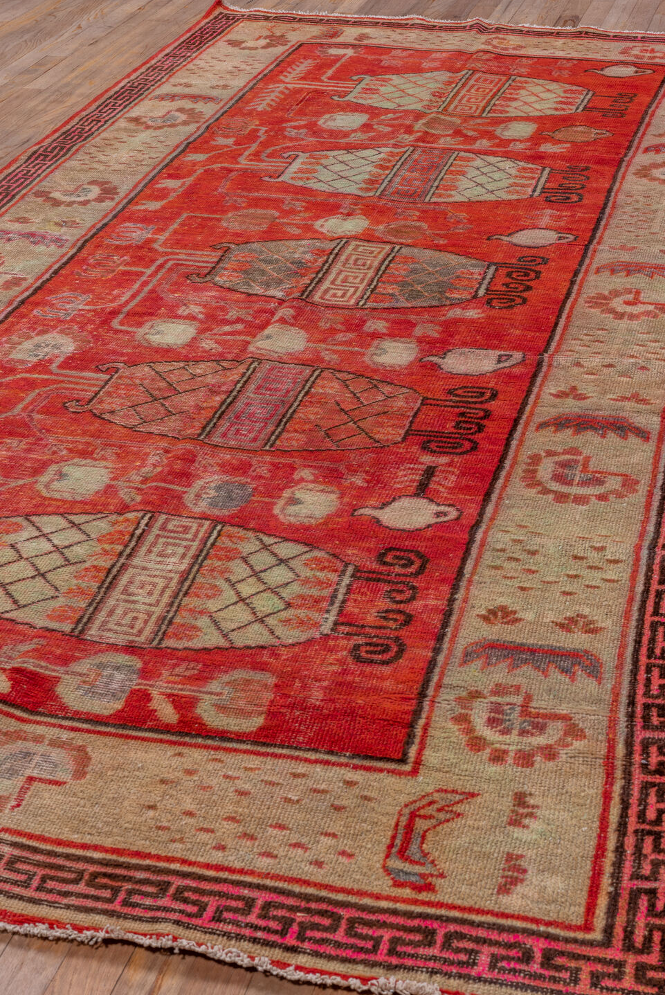 5' x 10' one-of-a-kind handmade vintage Khotan runner rug. Color palette: brown, fire brick, light coral, off-white, pink