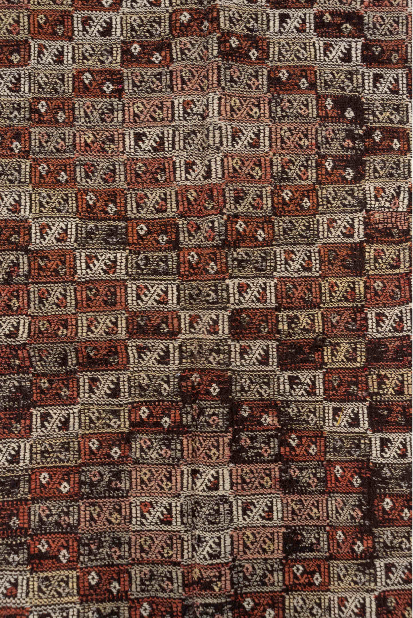 4' x 8' one-of-a-kind handmade vintage Jijim runner rug. Color palette: brown, gray, light gray, pink, redwood