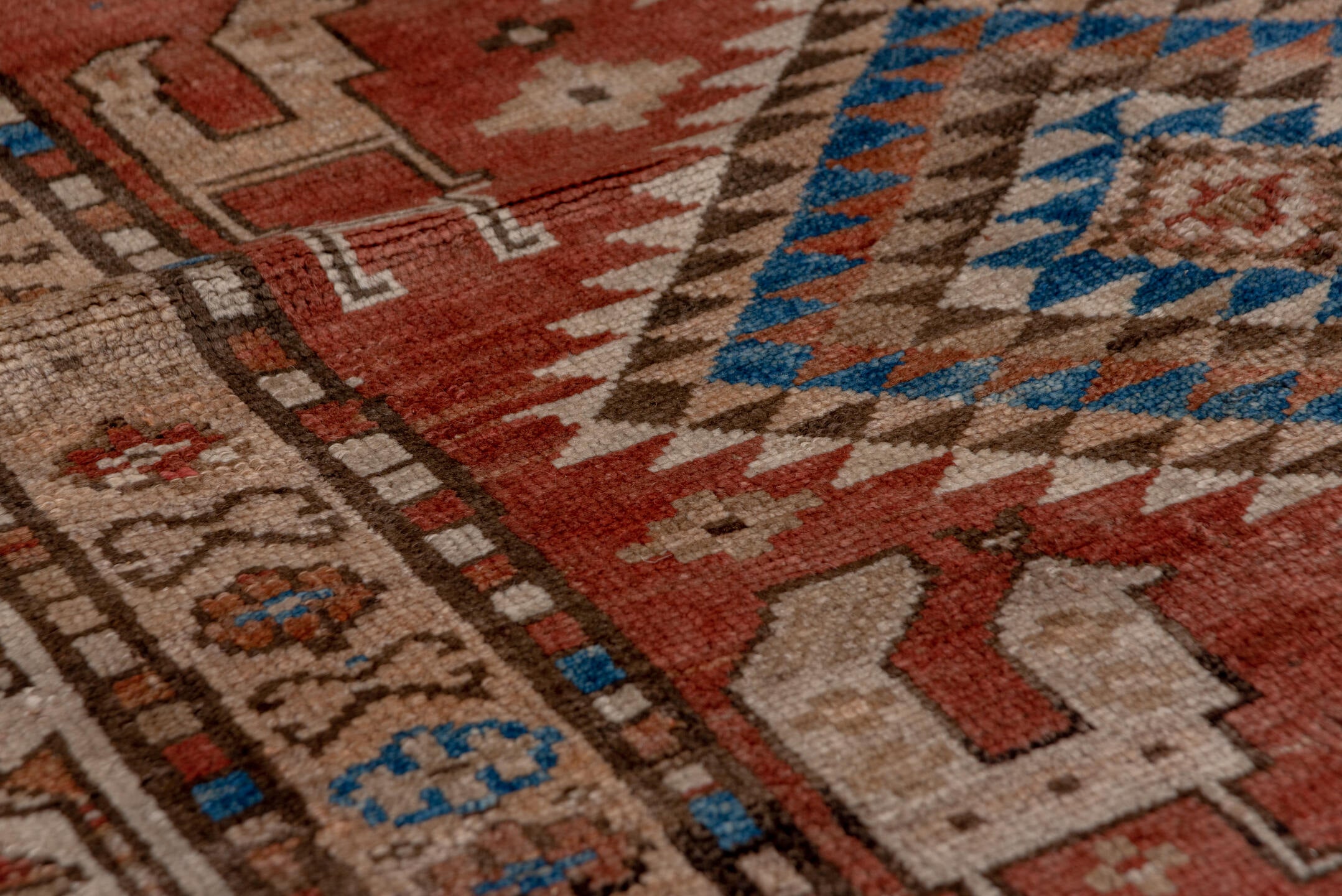 4' x 9' one-of-a-kind handmade vintage Kurd runner rug. Color palette: brown, gray, blue, pink, light gray, arapawa
