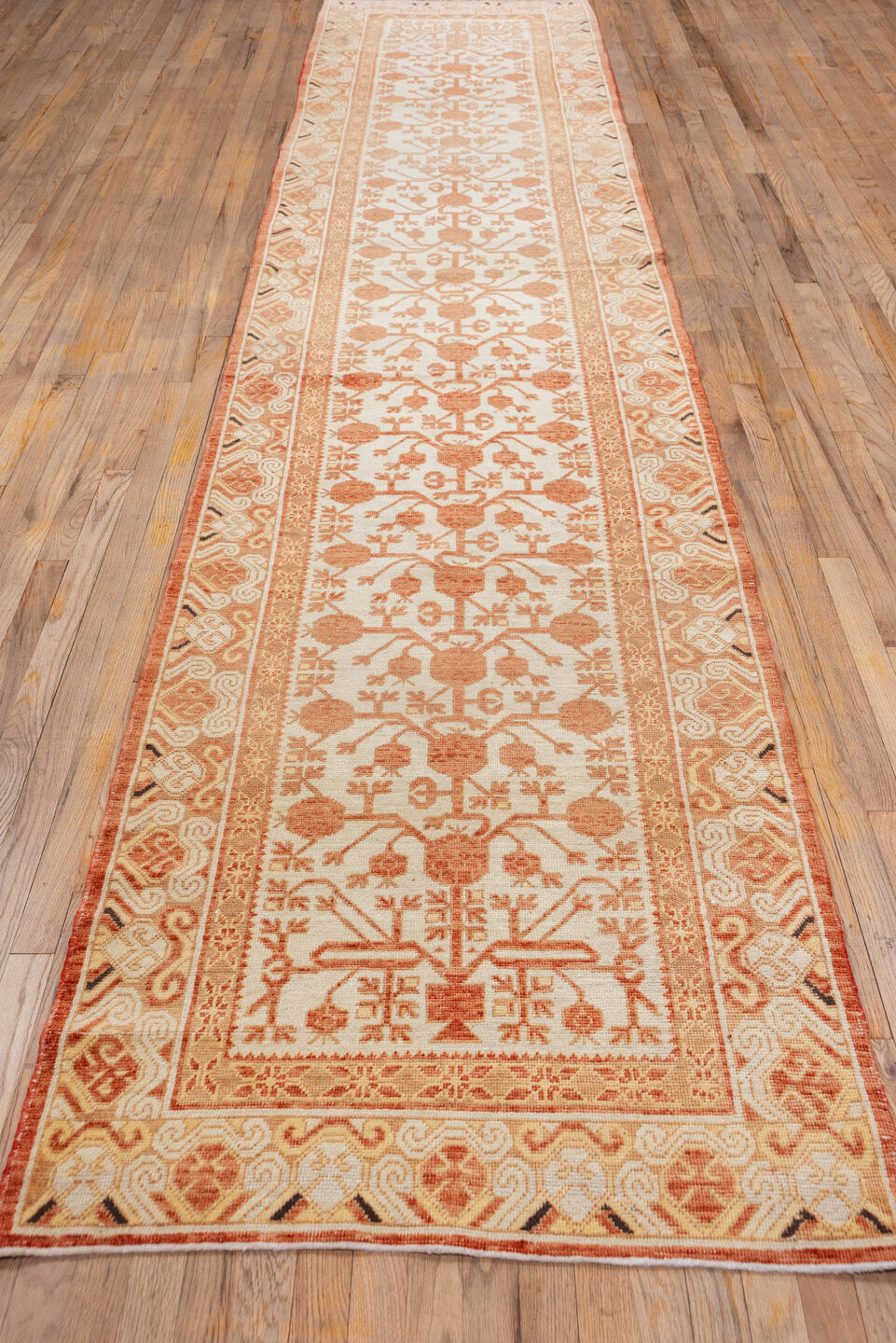 3' x 16' one-of-a-kind handmade vintage Khotan runner rug. Color palette: brown, orange, off-white, pink, white, snow