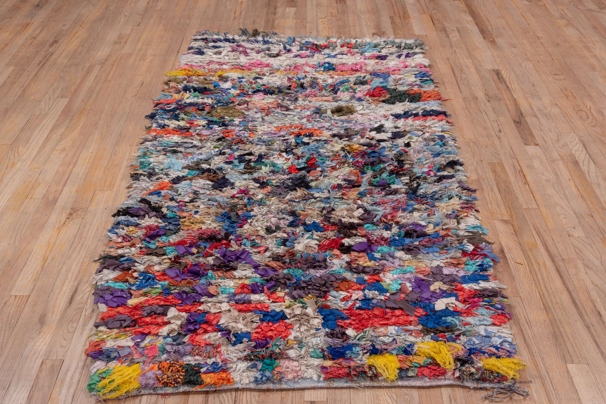 4' x 7' one-of-a-kind handmade vintage Rag Rug rug. Color palette: blue, brown, dark gray, gray, green, light gray