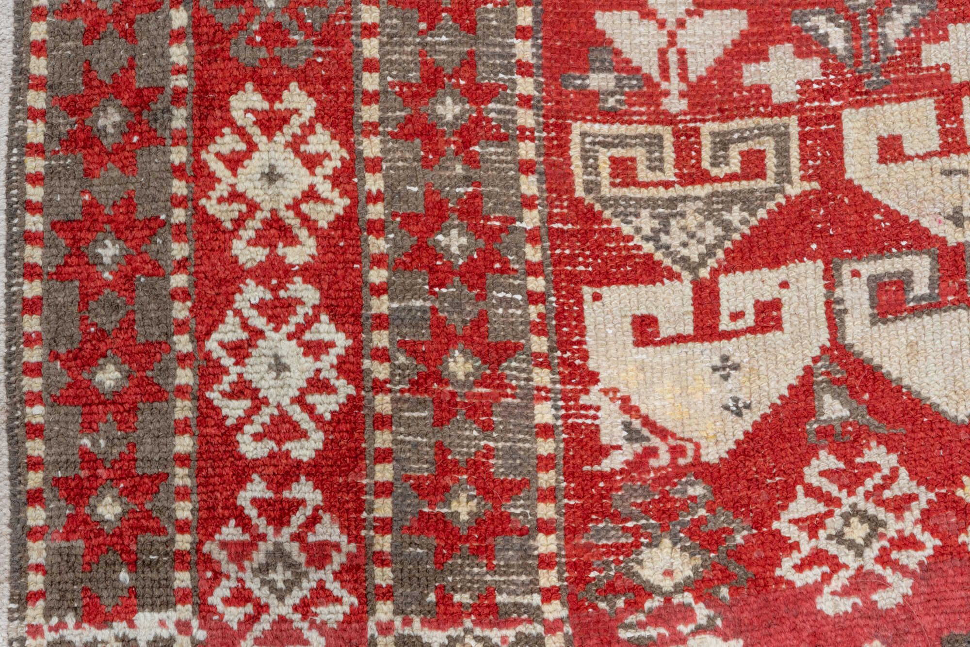 4' x 13' one-of-a-kind handmade vintage Caucasian runner rug. Color palette: brown, gray, pink, red