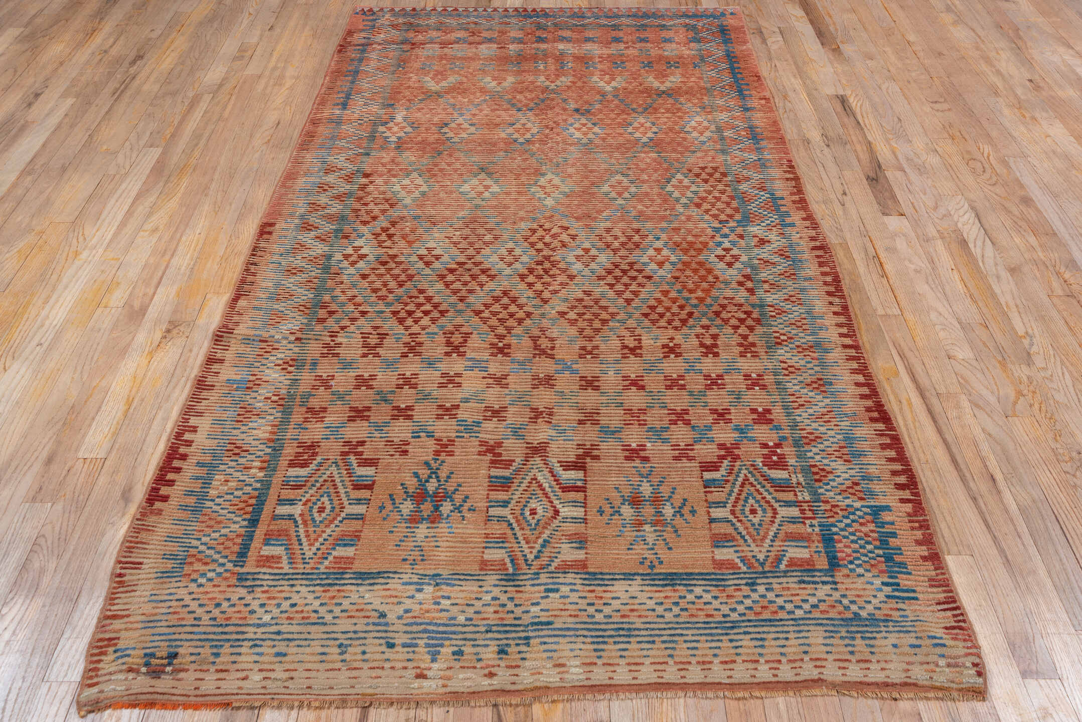 4' x 9' one-of-a-kind handmade vintage Moroccan runner rug. Color palette: pink, gray, brown, blue