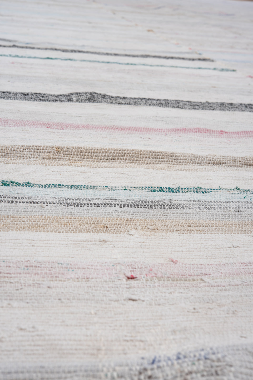 5' x 11' one-of-a-kind handmade vintage Rag Rug rug. Color palette: gray, light gray, off-white, dim gray, dark gray