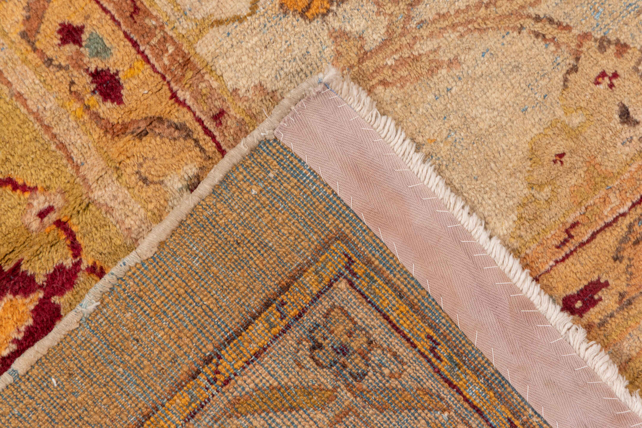 9' x 11' one-of-a-kind handmade vintage Amritzar large size rug. Color palette: brown, pink, orange, yellow, off-white, red