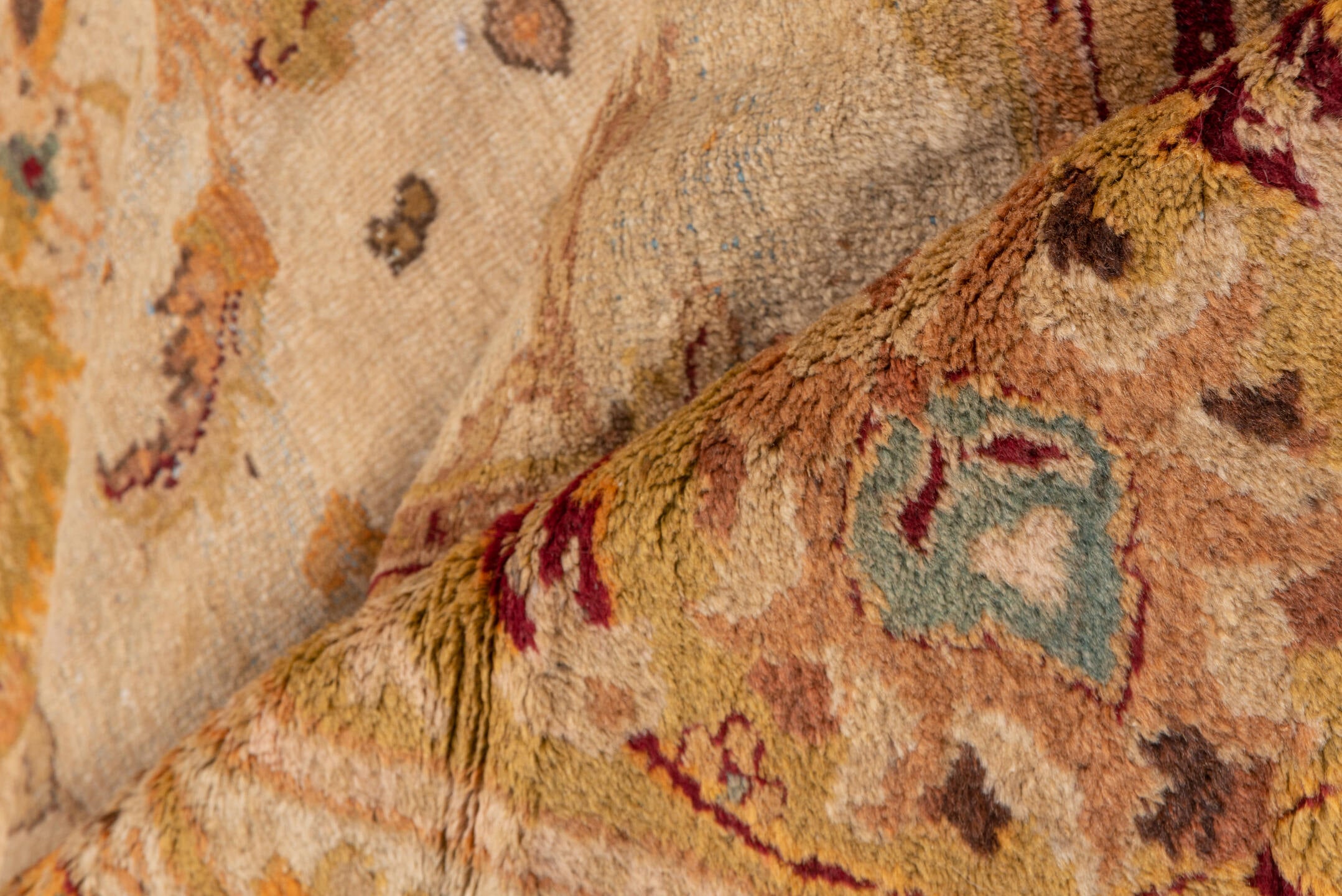 9' x 11' one-of-a-kind handmade vintage Amritzar large size rug. Color palette: brown, pink, orange, yellow, off-white, red