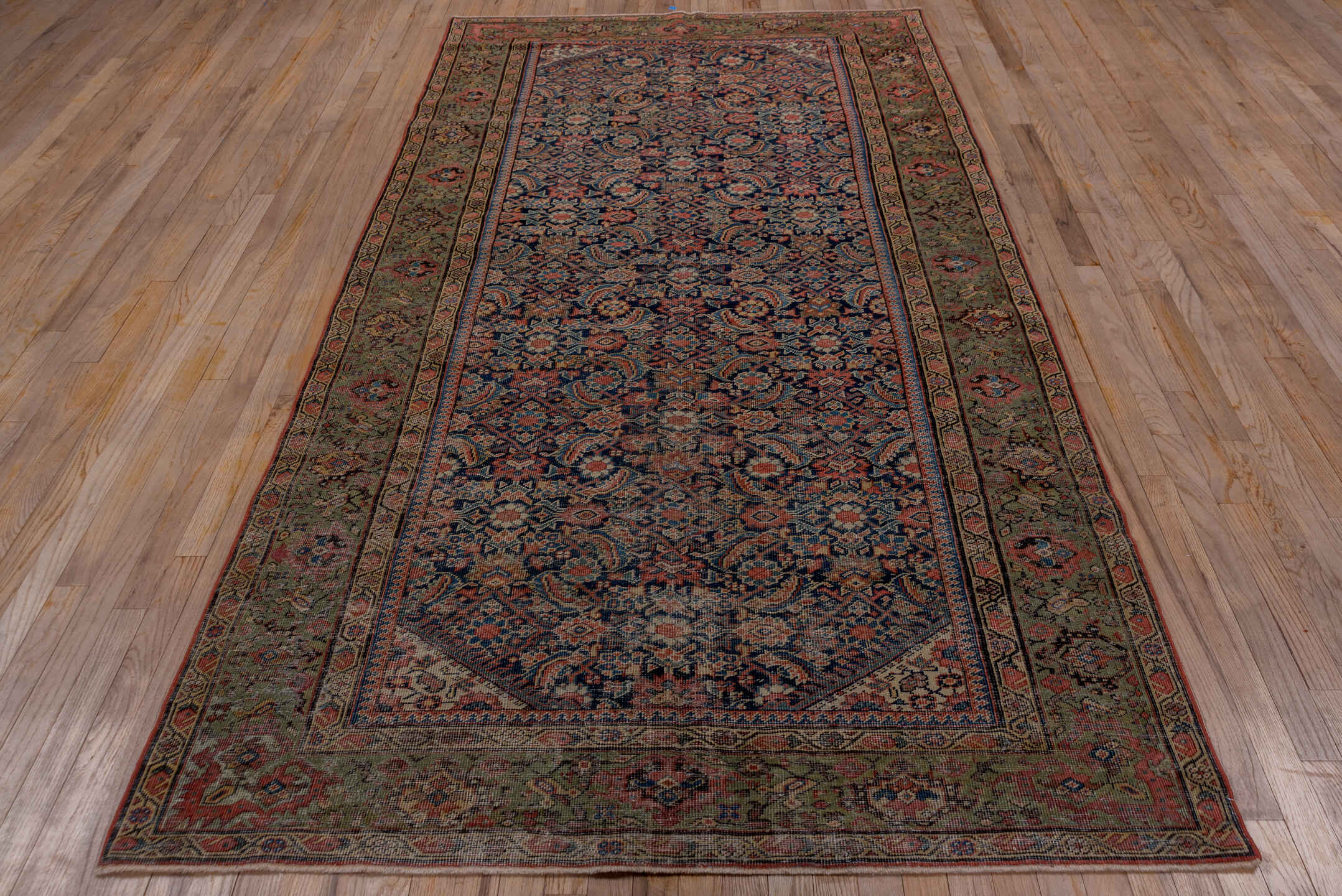 5' x 9' one-of-a-kind handmade vintage Farahan medium size rug. Color palette: gray, brown, red, black, pink, blue, redwood