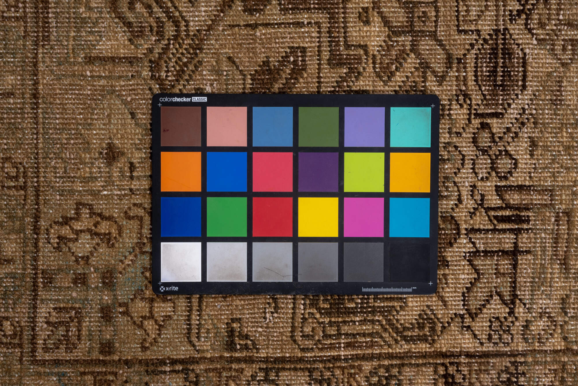 7' x 9' one-of-a-kind handmade vintage Heriz rug. Color palette: brown, light gray, gray, off-white, orange, pink, black