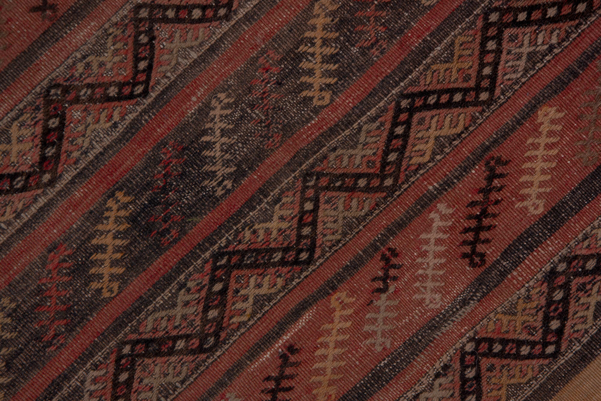 2' x 15' one-of-a-kind handmade vintage Jijim runner rug. Color palette: brown, gray, off-white, pink, red, redwood, snow