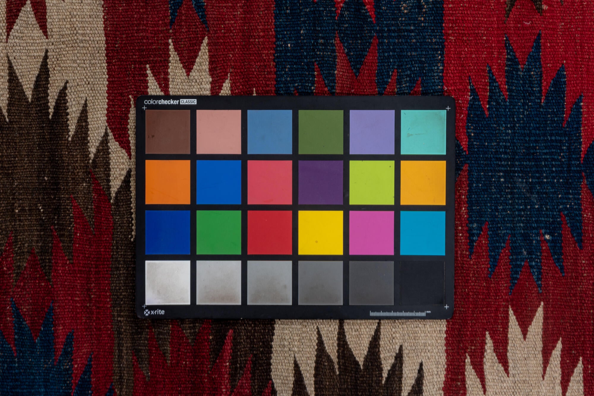 6' x 9' one-of-a-kind handmade vintage Kilim medium size rug. Color palette: black, brown, gray, pink, red