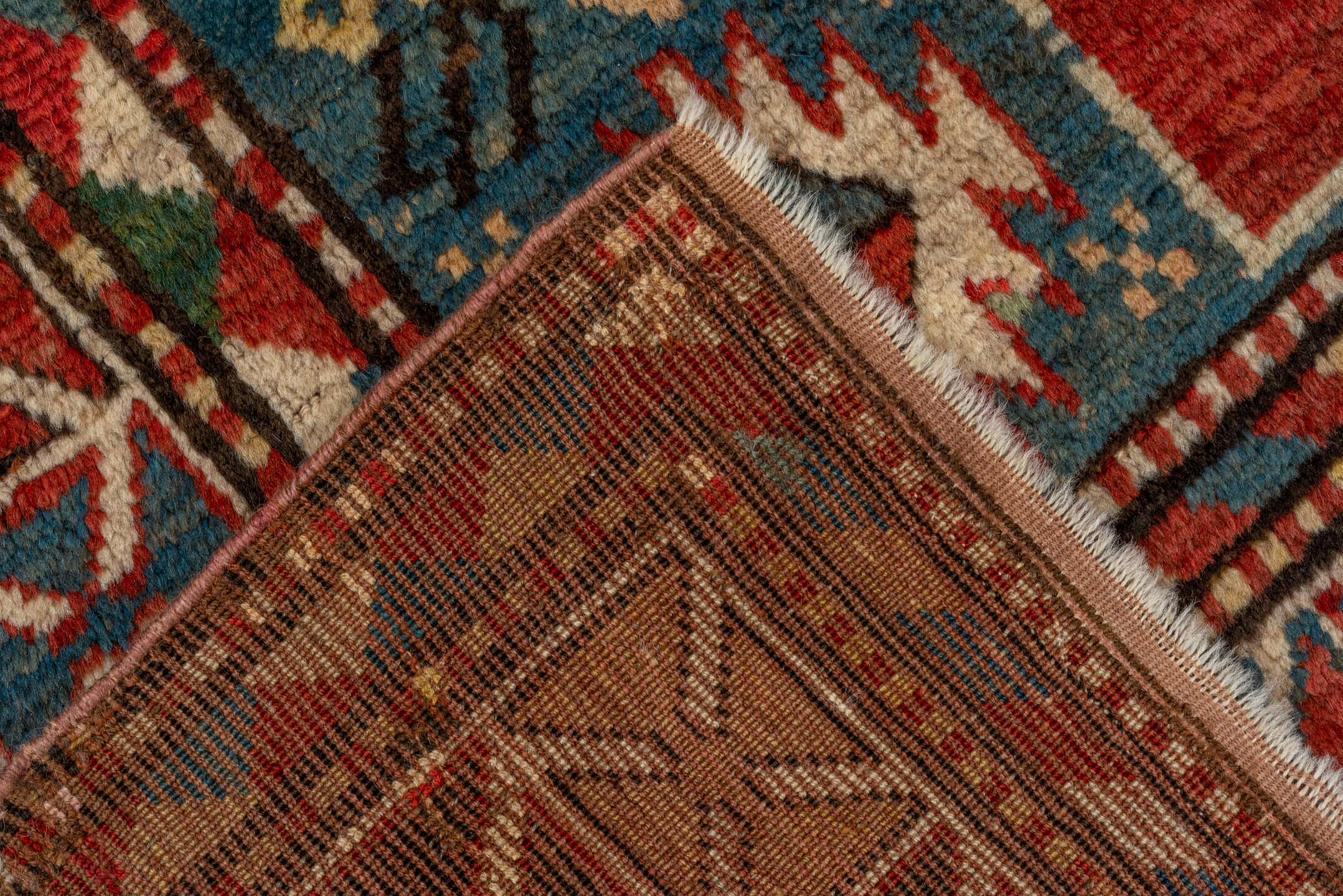 3' x 7' one-of-a-kind handmade vintage Kazak rug. Color palette: brown, gray, pink, blue, red, arapawa, redwood