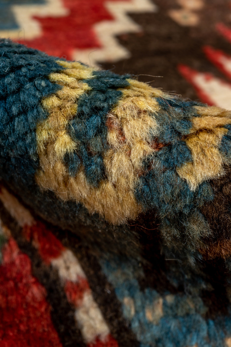 3' x 7' one-of-a-kind handmade vintage Kazak rug. Color palette: brown, gray, pink, blue, red, arapawa, redwood