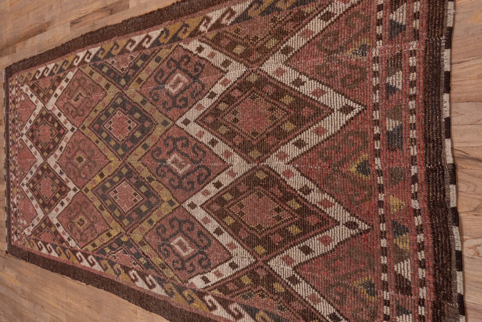 4' x 12' one-of-a-kind handmade vintage Ouzbek runner rug. Color palette: brown, pink, redwood