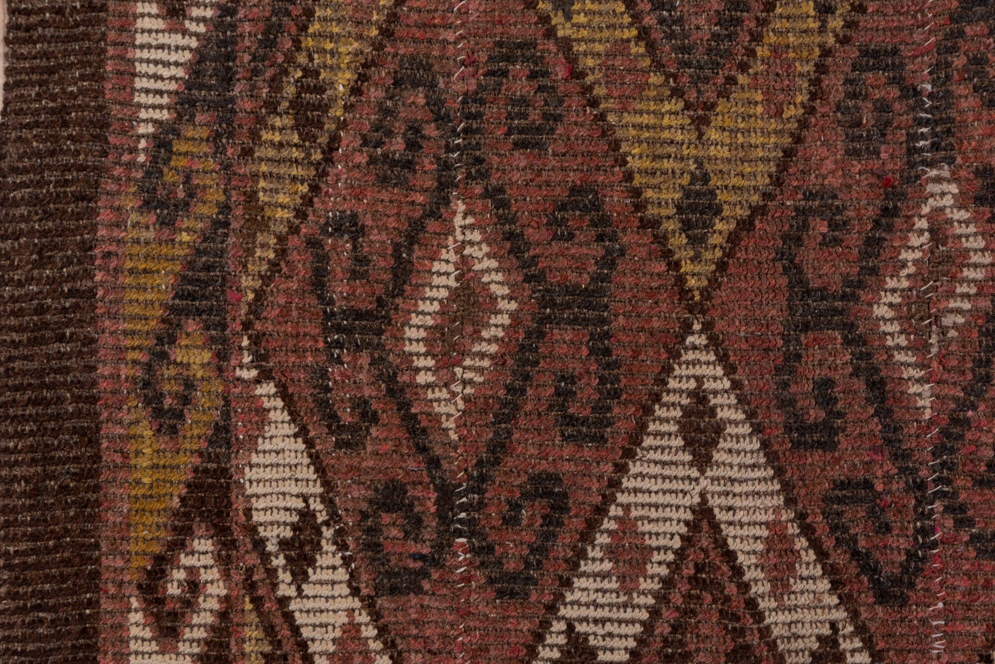 4' x 12' one-of-a-kind handmade vintage Ouzbek runner rug. Color palette: brown, pink, redwood