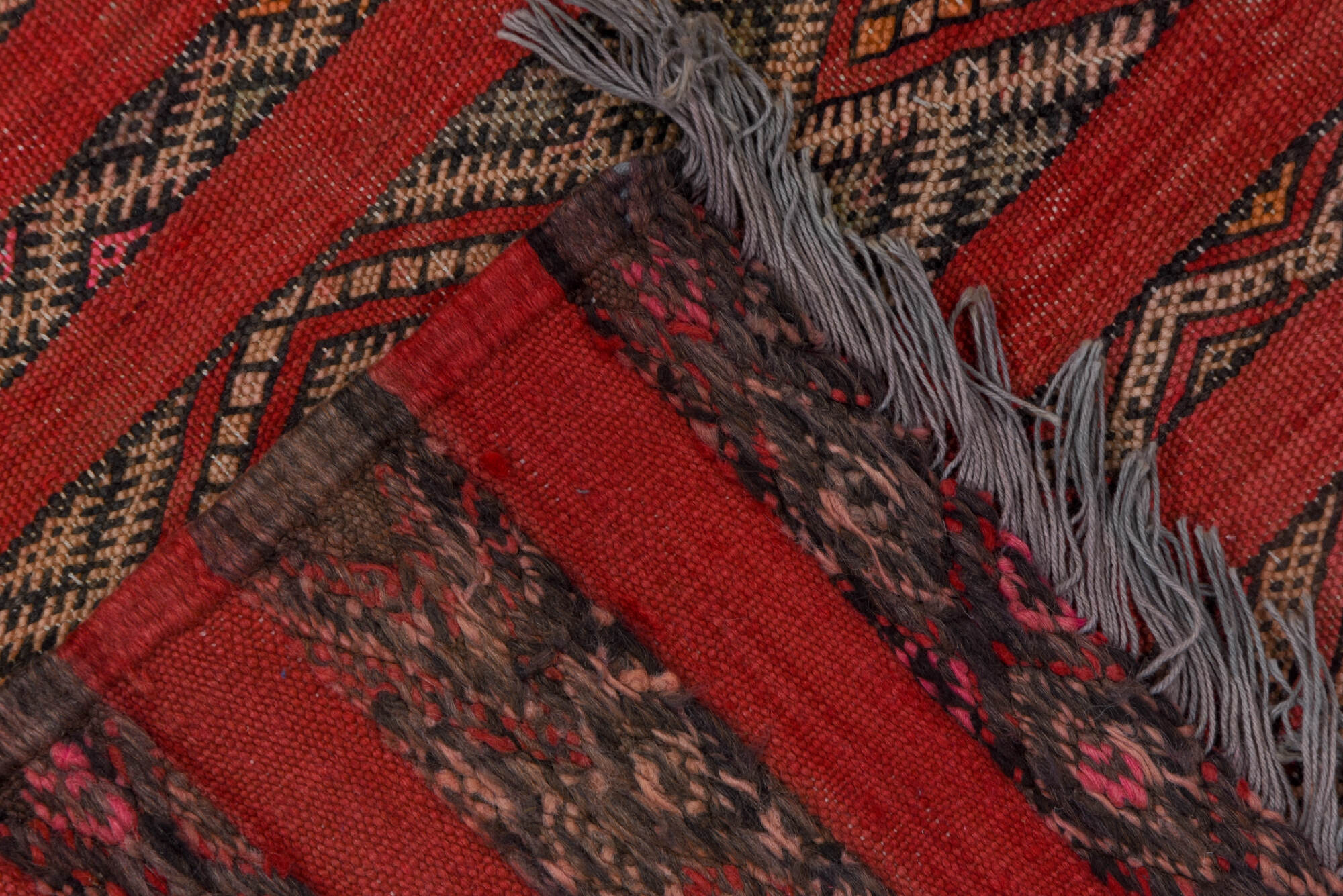 5' x 7' one-of-a-kind handmade vintage Kilim rug. Color palette: brown, gray, light gray, pink, red, redwood