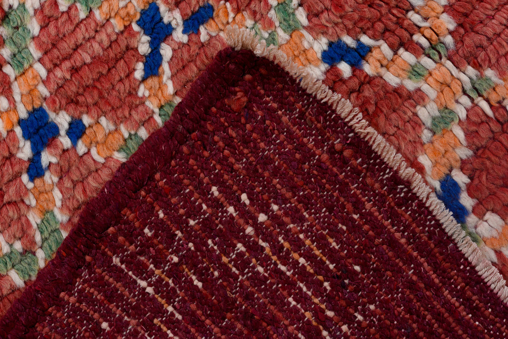 4' x 11' one-of-a-kind handmade vintage Moroccan runner rug. Color palette: pink, red, gray, light gray, brown, off-white