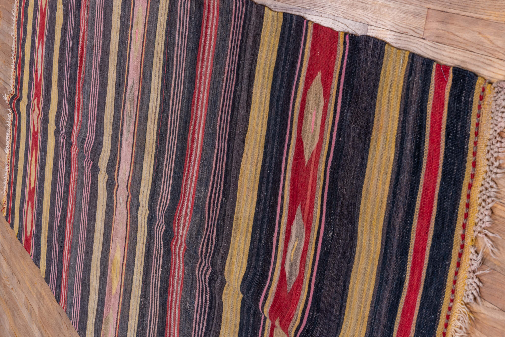 4' x 11' one-of-a-kind handmade vintage Kilim runner rug. Color palette: black, brown, charcoal, gray, pink, red