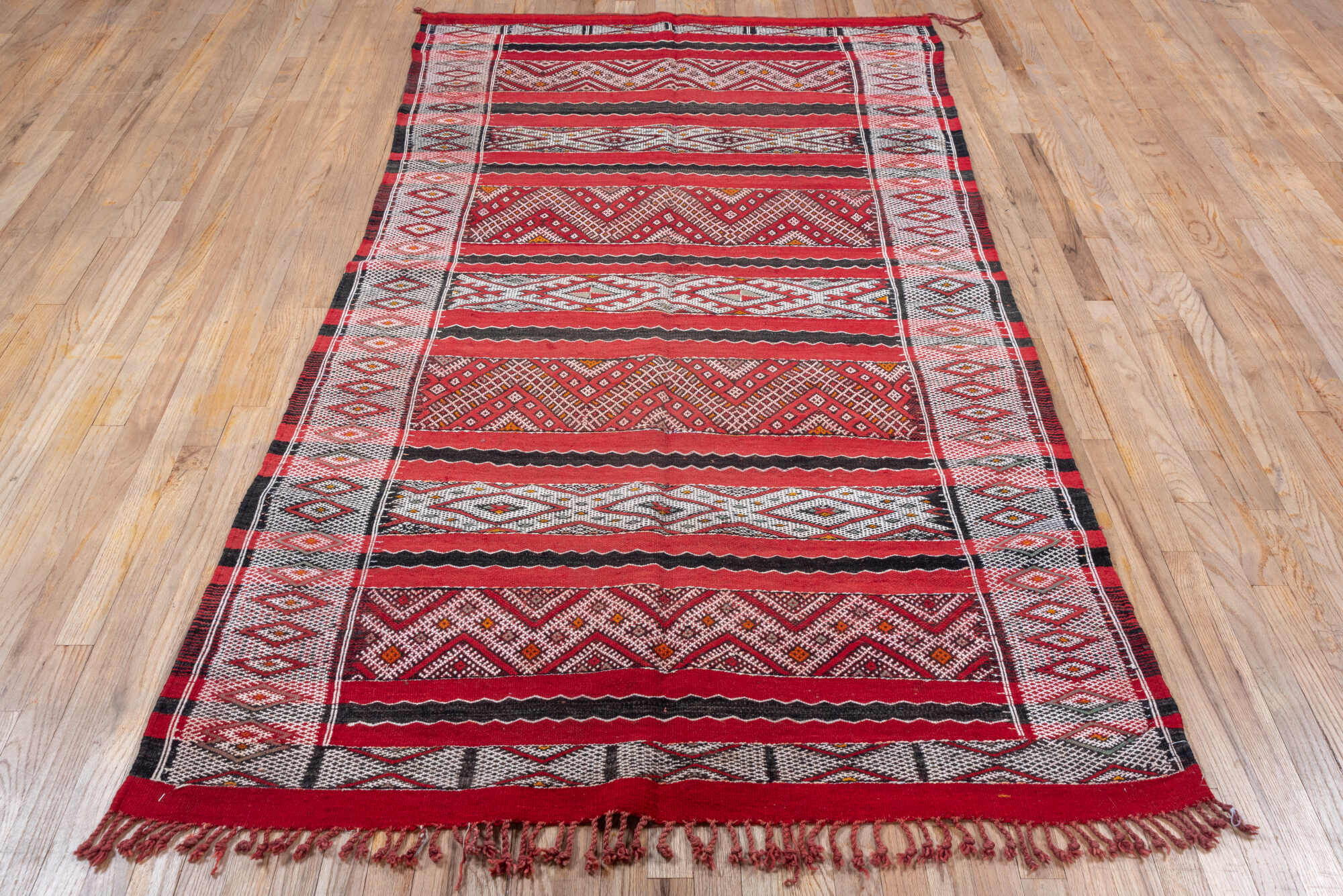 4' x 8' one-of-a-kind handmade vintage Kilim rug. Color palette: brown, gray, light gray, off-white, pink, red