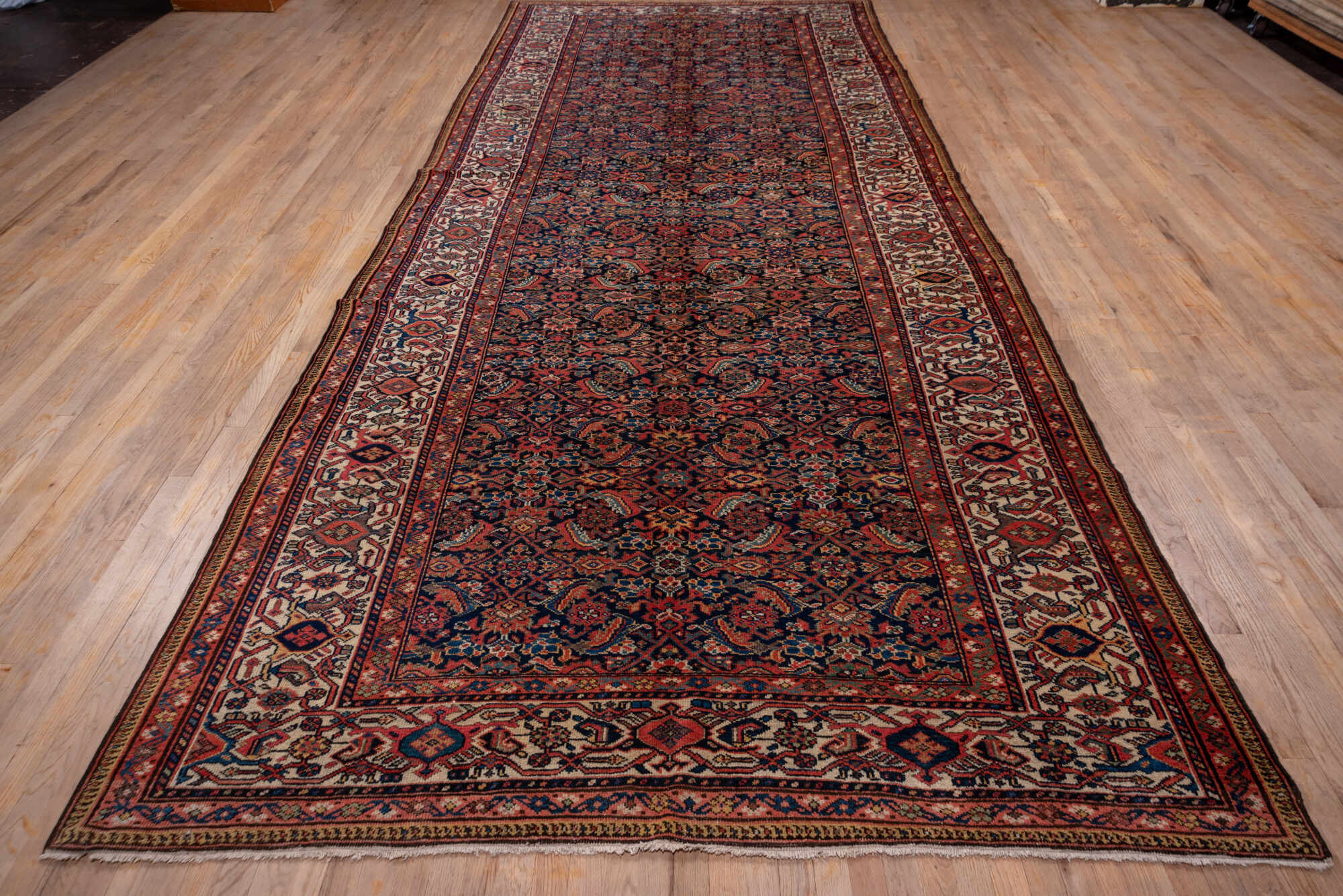 7' x 17' one-of-a-kind handmade vintage Mahal rug. Color palette: black, blue, brown, gray, light gray, pink, red