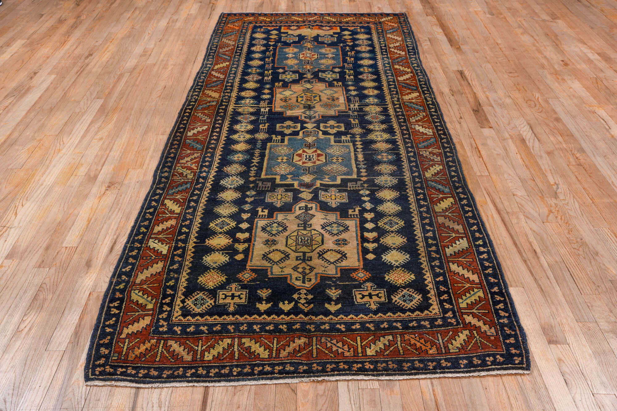 4' x 10' one-of-a-kind handmade vintage Hamadan runner rug. Color palette: black, blue, brown, gray, saddle brown
