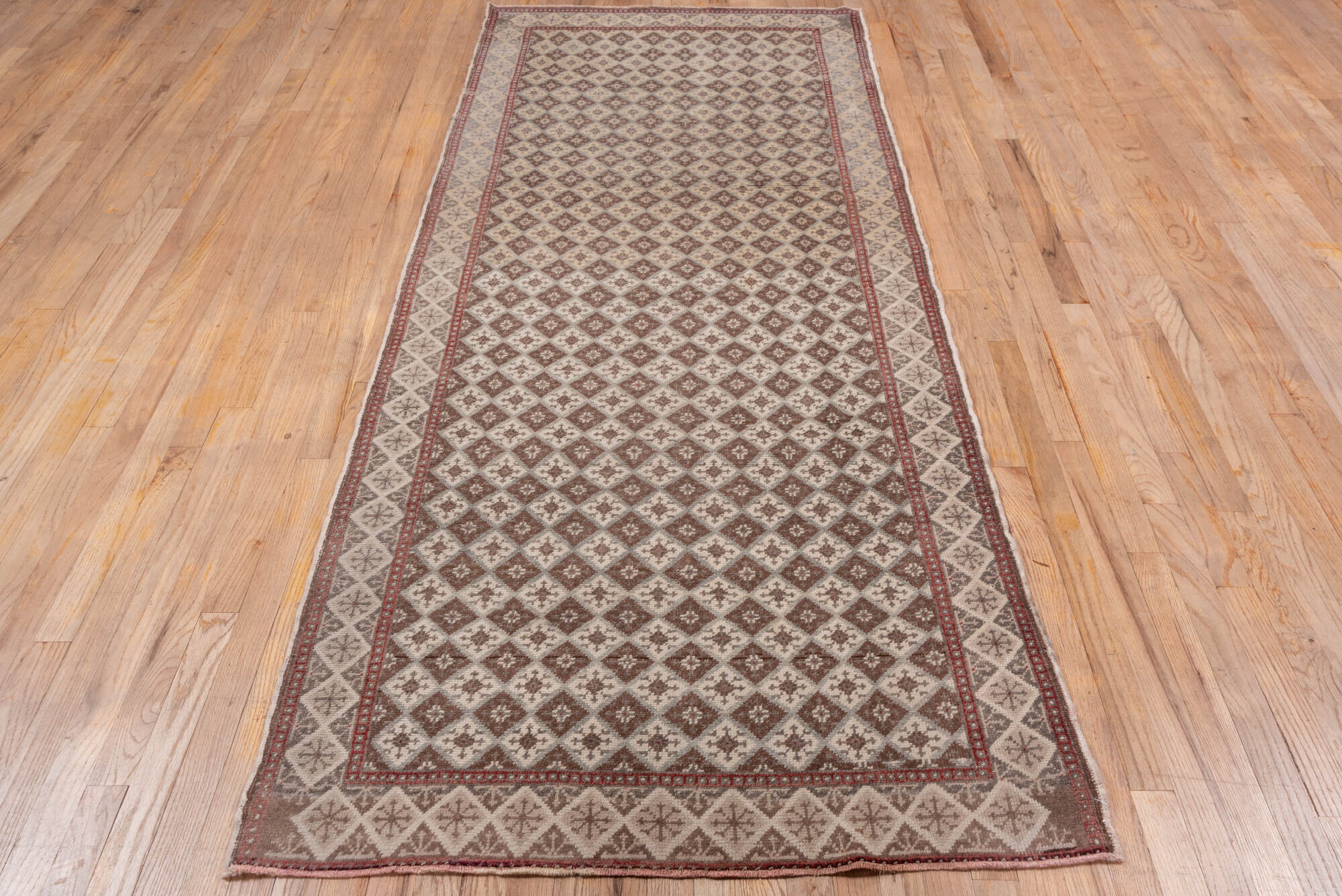 3' x 9' one-of-a-kind handmade vintage Oushak runner rug. Color palette: brown, gray, light gray, off-white, pink