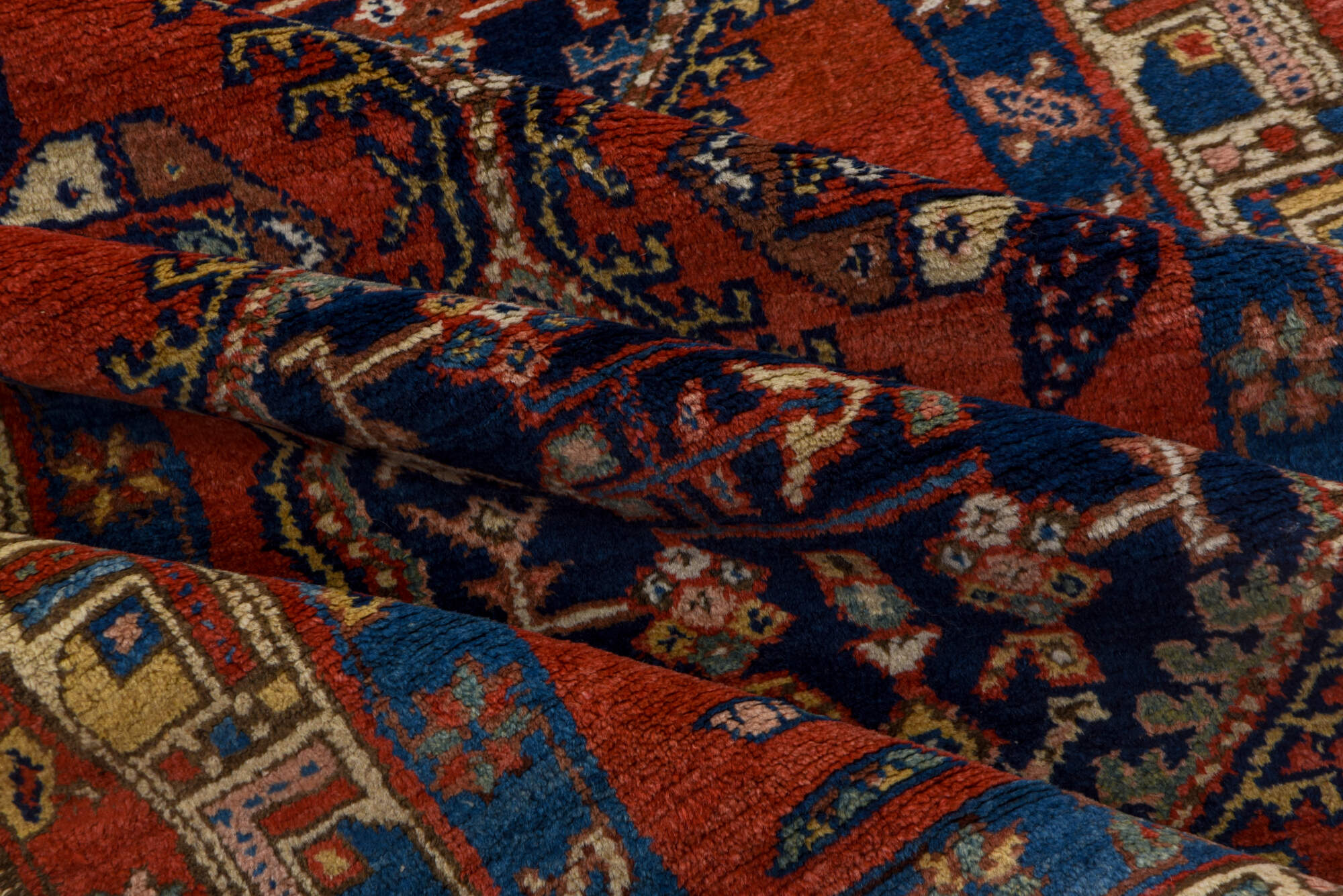 3' x 9' one-of-a-kind handmade vintage Heriz runner rug. Color palette: blue, brown, gray, maroon, pink, red, redwood