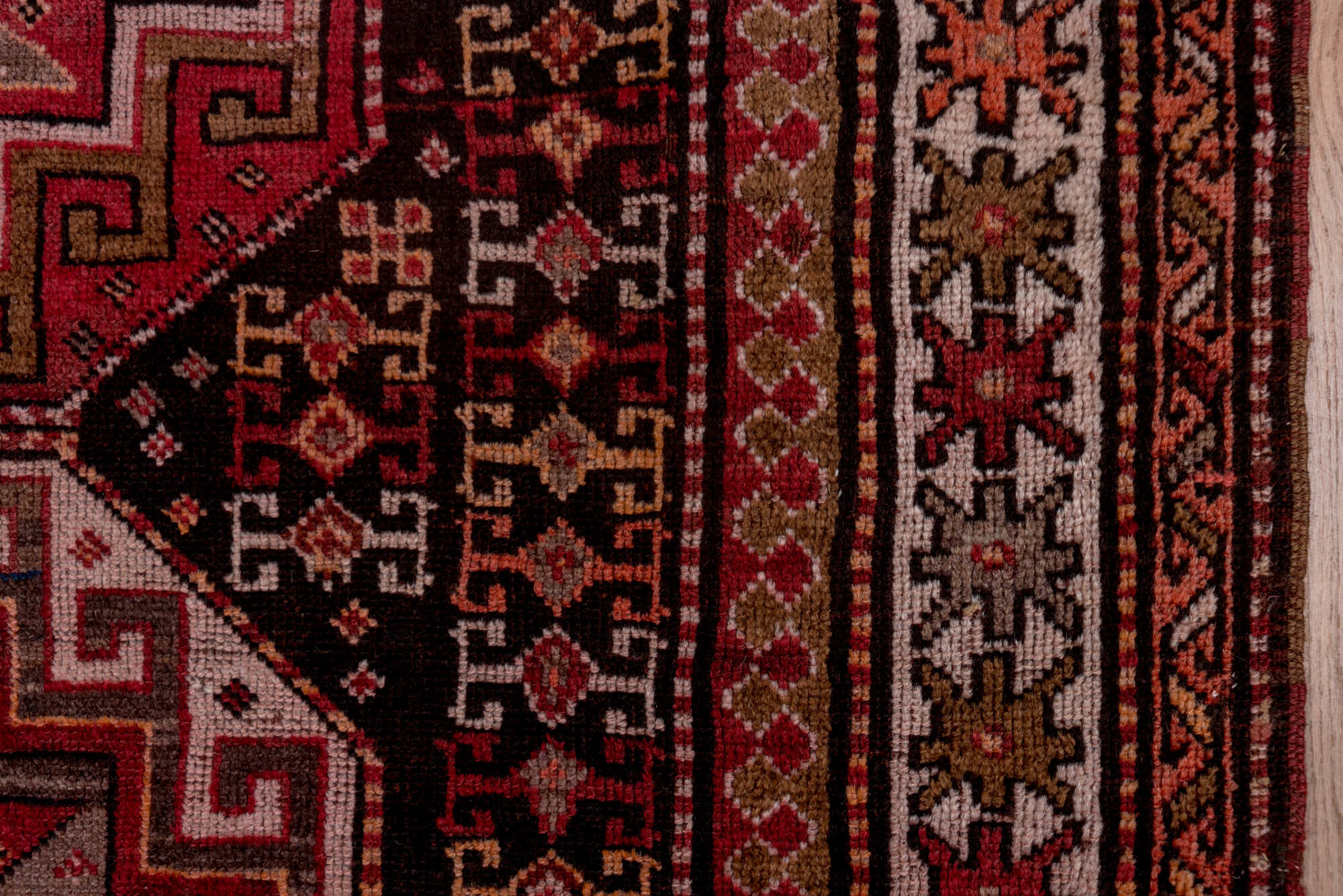 4' x 9' one-of-a-kind handmade vintage Kazak runner rug. Color palette: brown, gray, pink, red, rosy brown