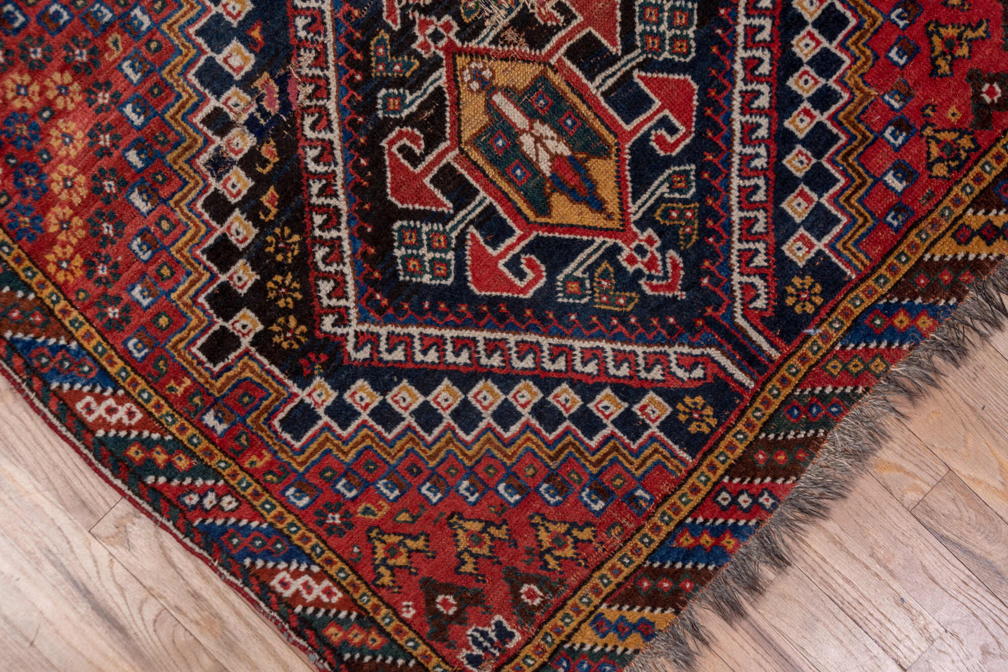 3' x 9' one-of-a-kind handmade vintage Shiraz runner rug. Color palette: black, blue, brown, fiord, gray, pink, red