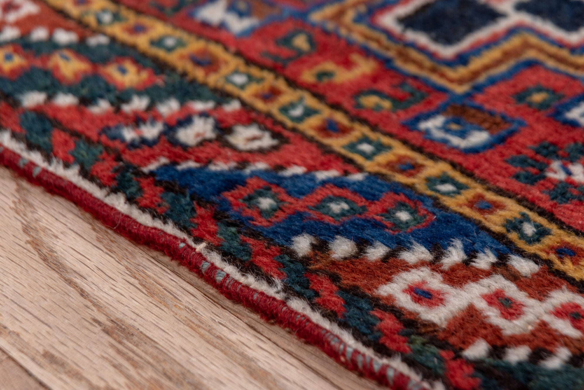 3' x 9' one-of-a-kind handmade vintage Shiraz runner rug. Color palette: black, blue, brown, fiord, gray, pink, red