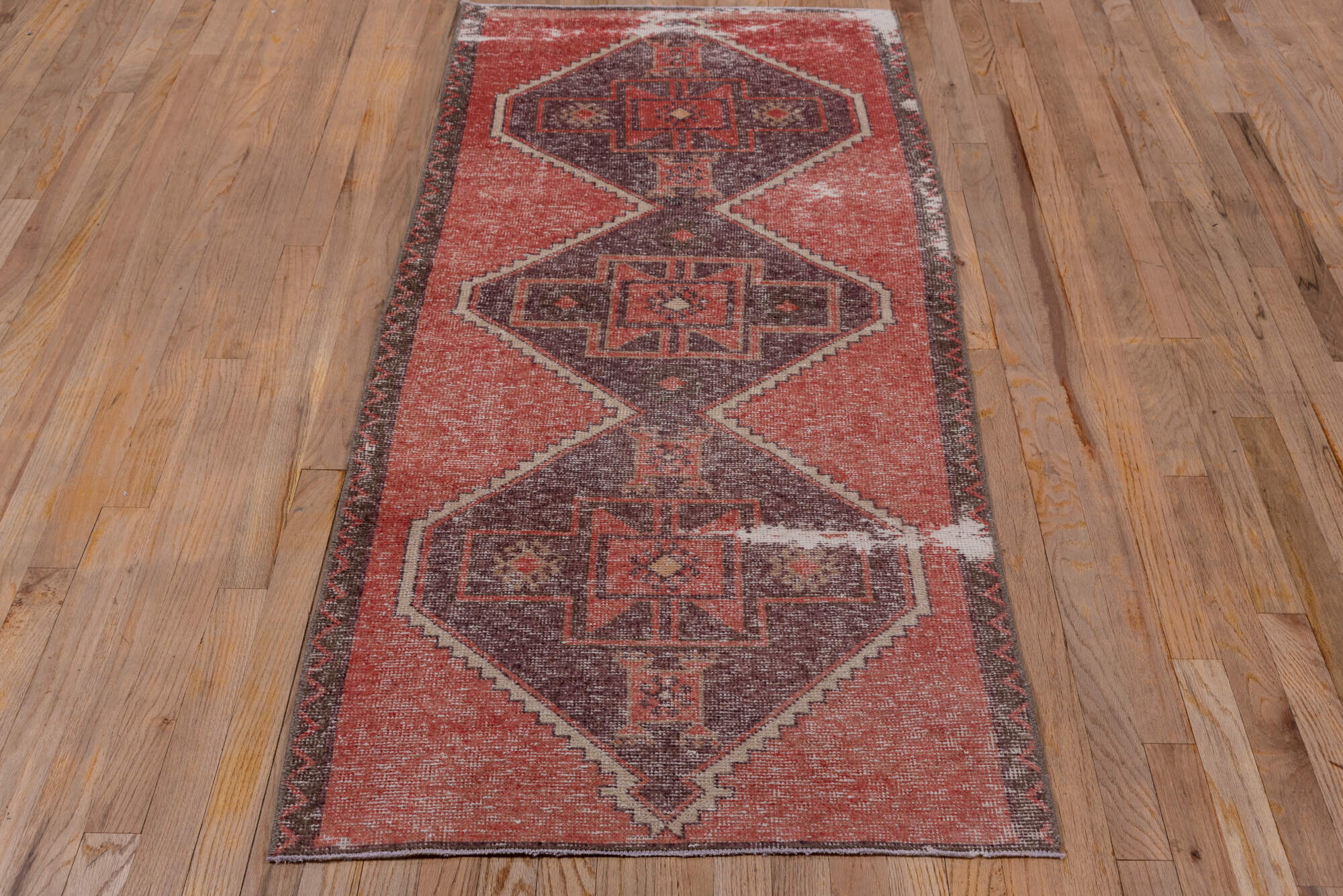 2' x 6' one-of-a-kind handmade vintage Oushak runner rug. Color palette: brown, gray, light gray, pink, red, wine