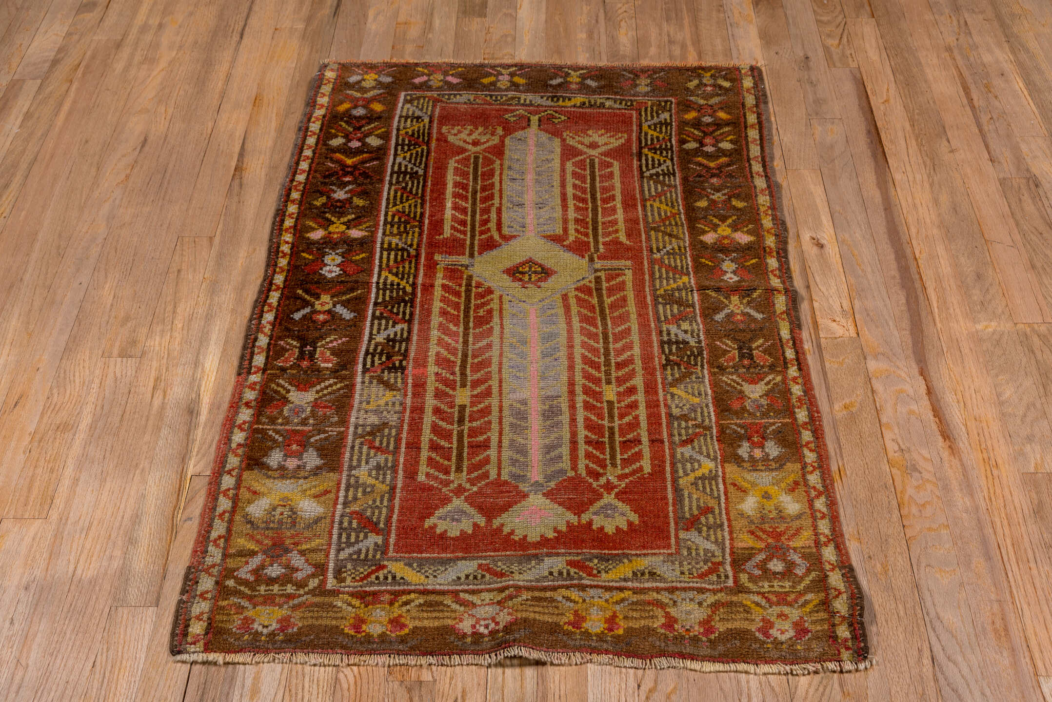 2' x 4' one-of-a-kind handmade vintage Oushak small size rug. Color palette: brown, gray, pink, red, yellow, off-white