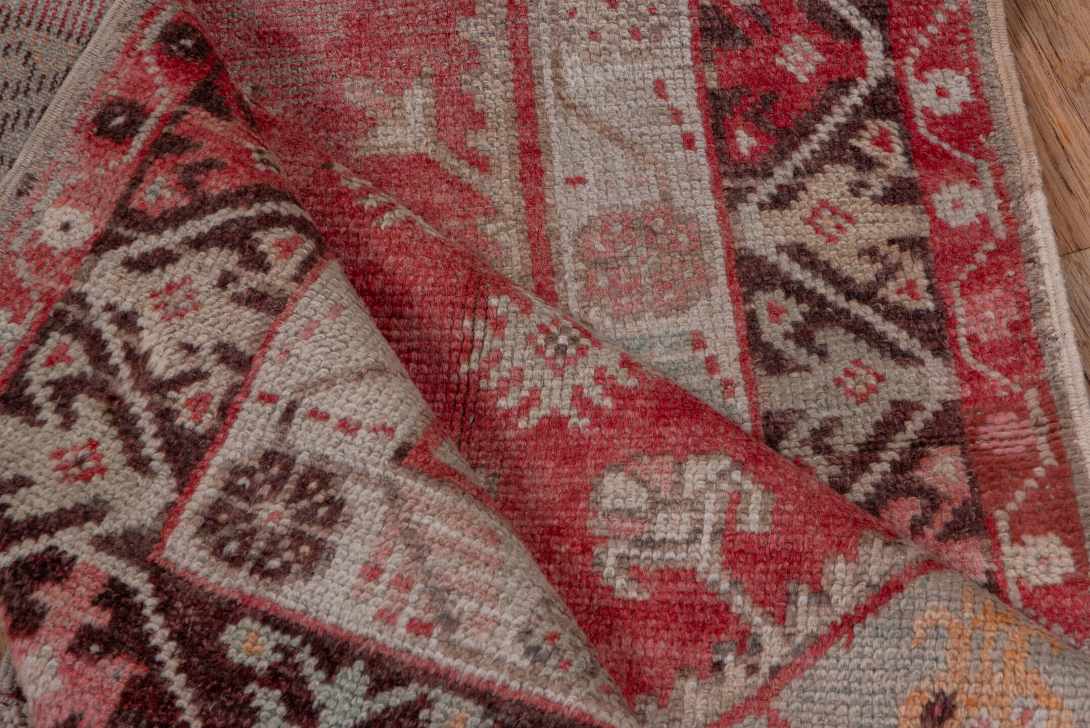 3' x 10' one-of-a-kind handmade vintage Oushak runner rug. Color palette: pink, gray, light gray, off-white, brown, red