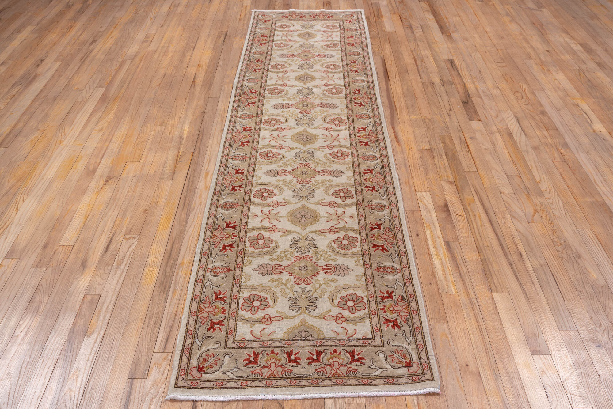 2' x 10' one-of-a-kind handmade vintage Tabriz runner rug. Color palette: brown, gray, light gray, off-white, pink, red