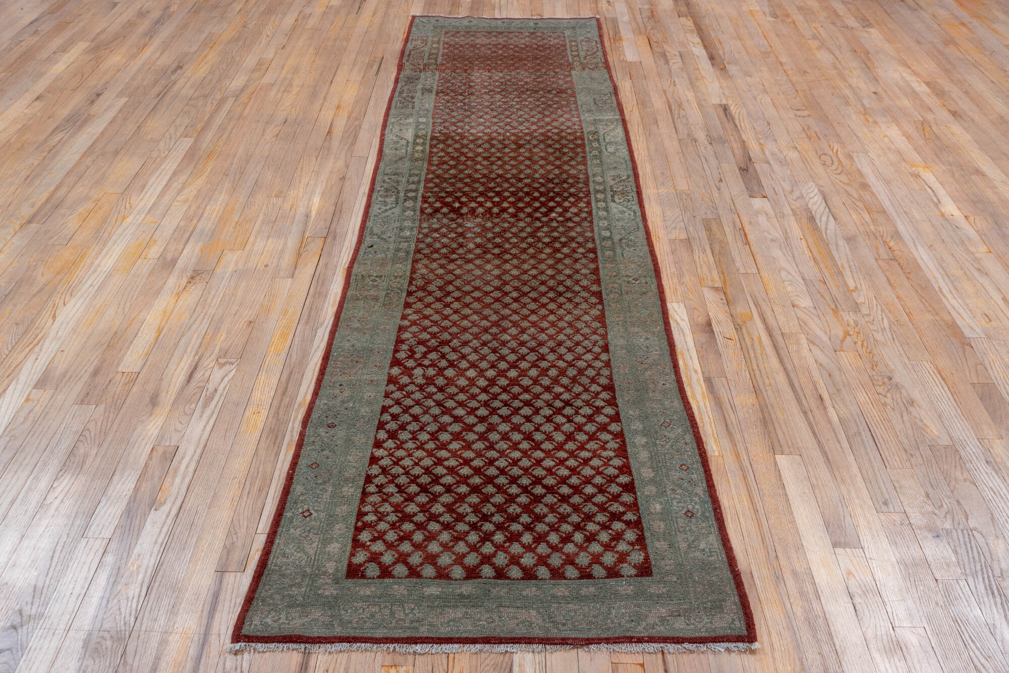 3' x 10' one-of-a-kind handmade vintage Saraband runner rug. Color palette: brown, gray, off-white, red, redwood, snow