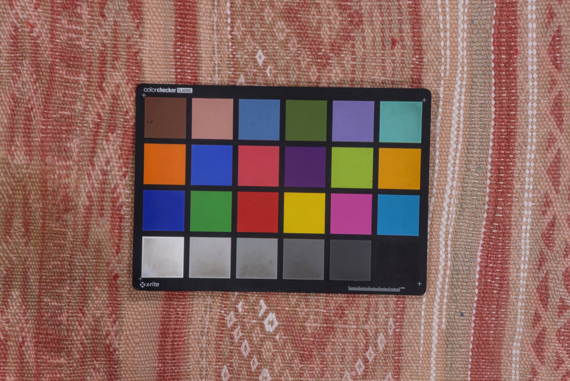 4' x 10' one-of-a-kind handmade vintage Moroccan runner rug. Color palette: brown, gray, light gray, off-white, pink, red